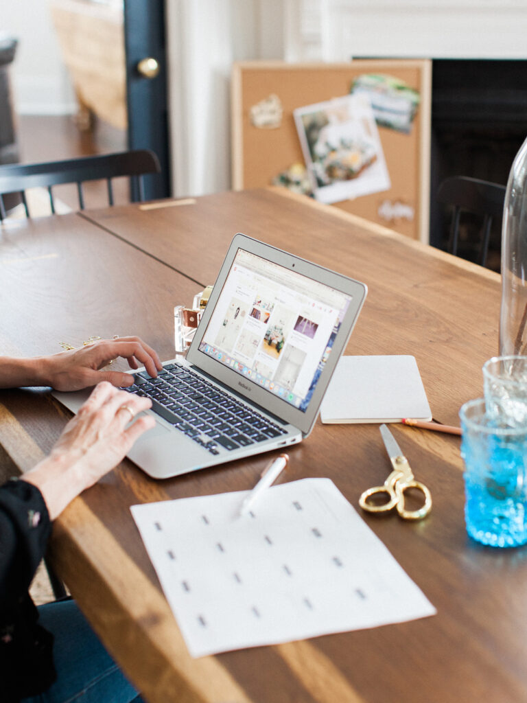 woman on computer creating pinterest content